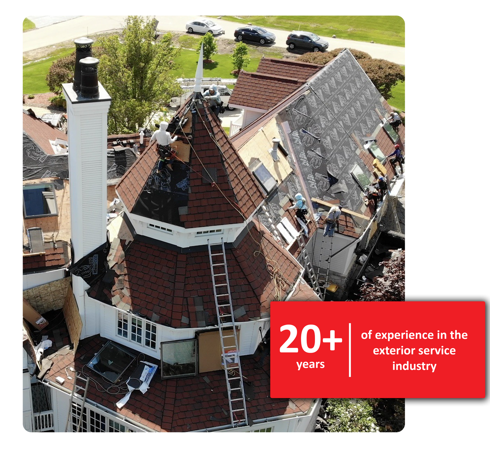 Roofing crew working on a house with a steep roof; 20+ years experience.