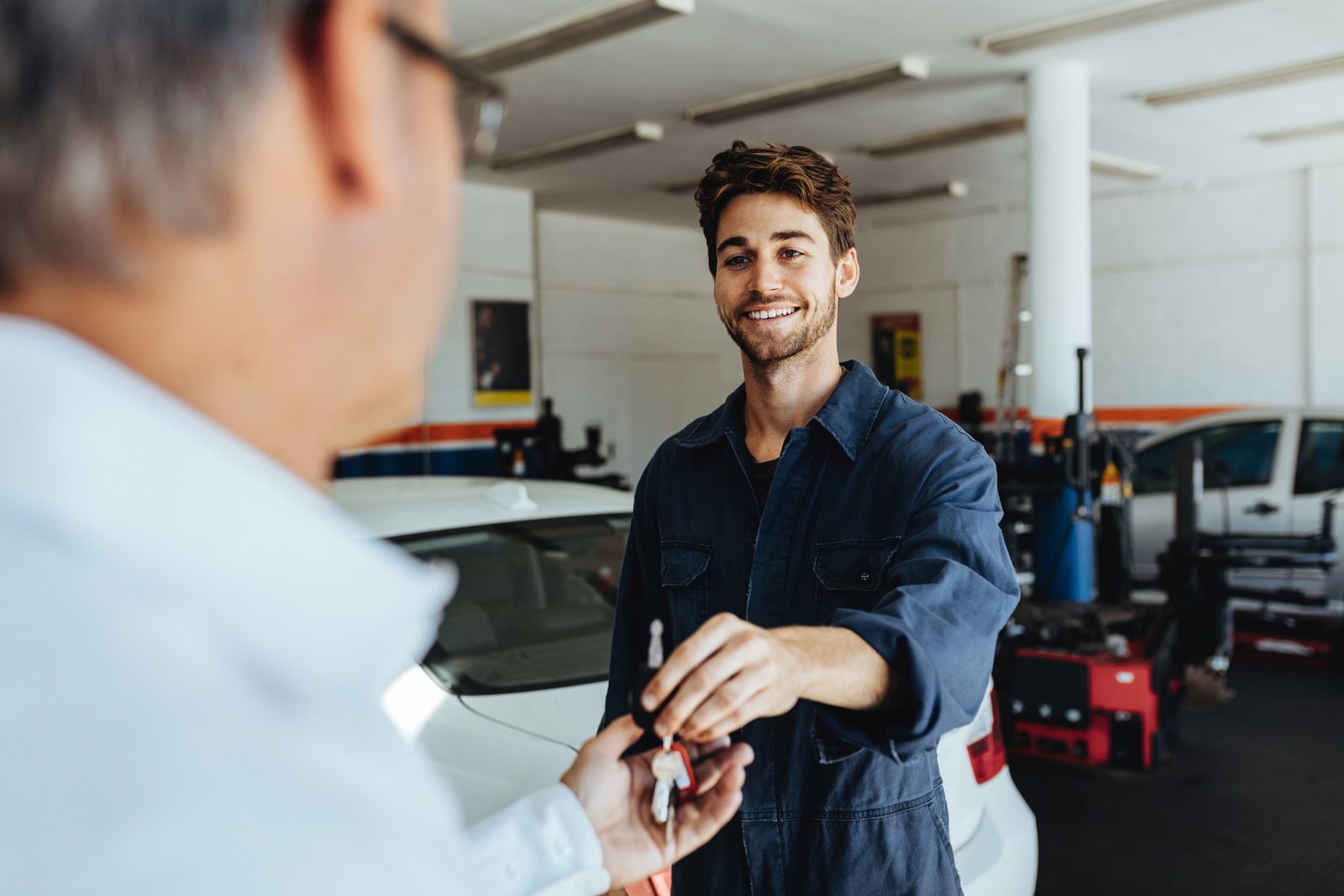 Mechanic Giving Car Keys To Customer — Midland, MI — D And J Auto Repair