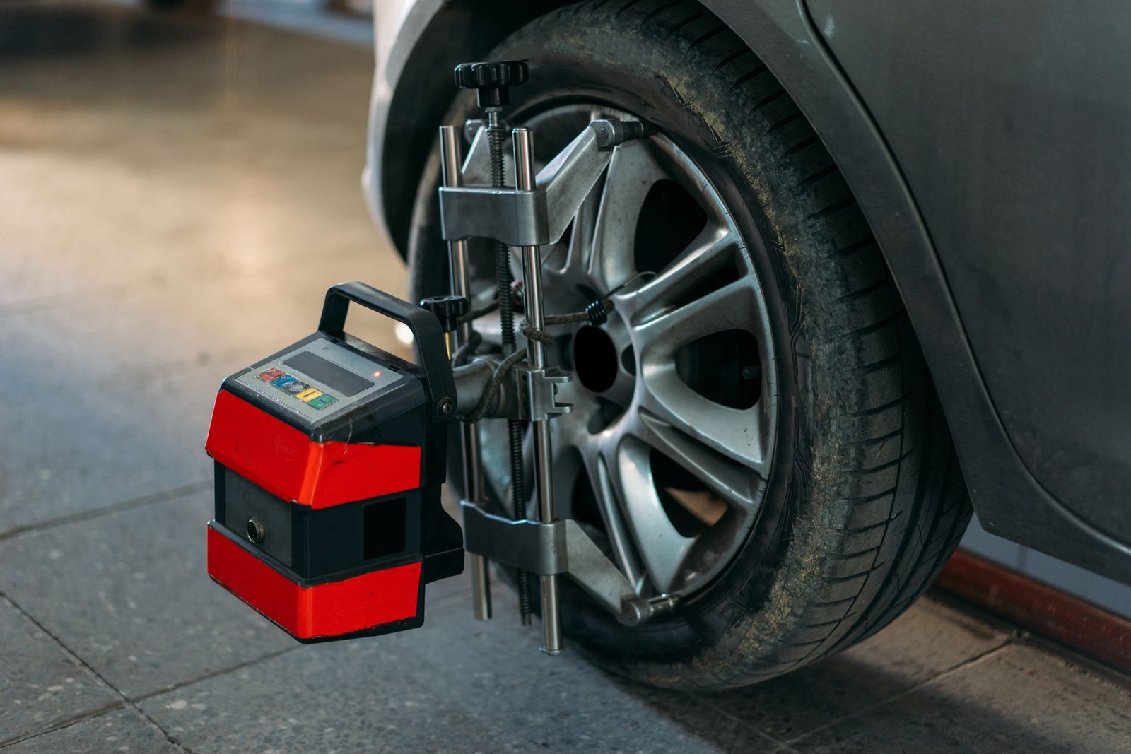 Tire Clamped With Aligner — Midland, MI — D And J Auto Repair