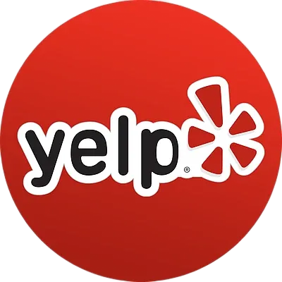 Yelp logo in white and black on a red circular background