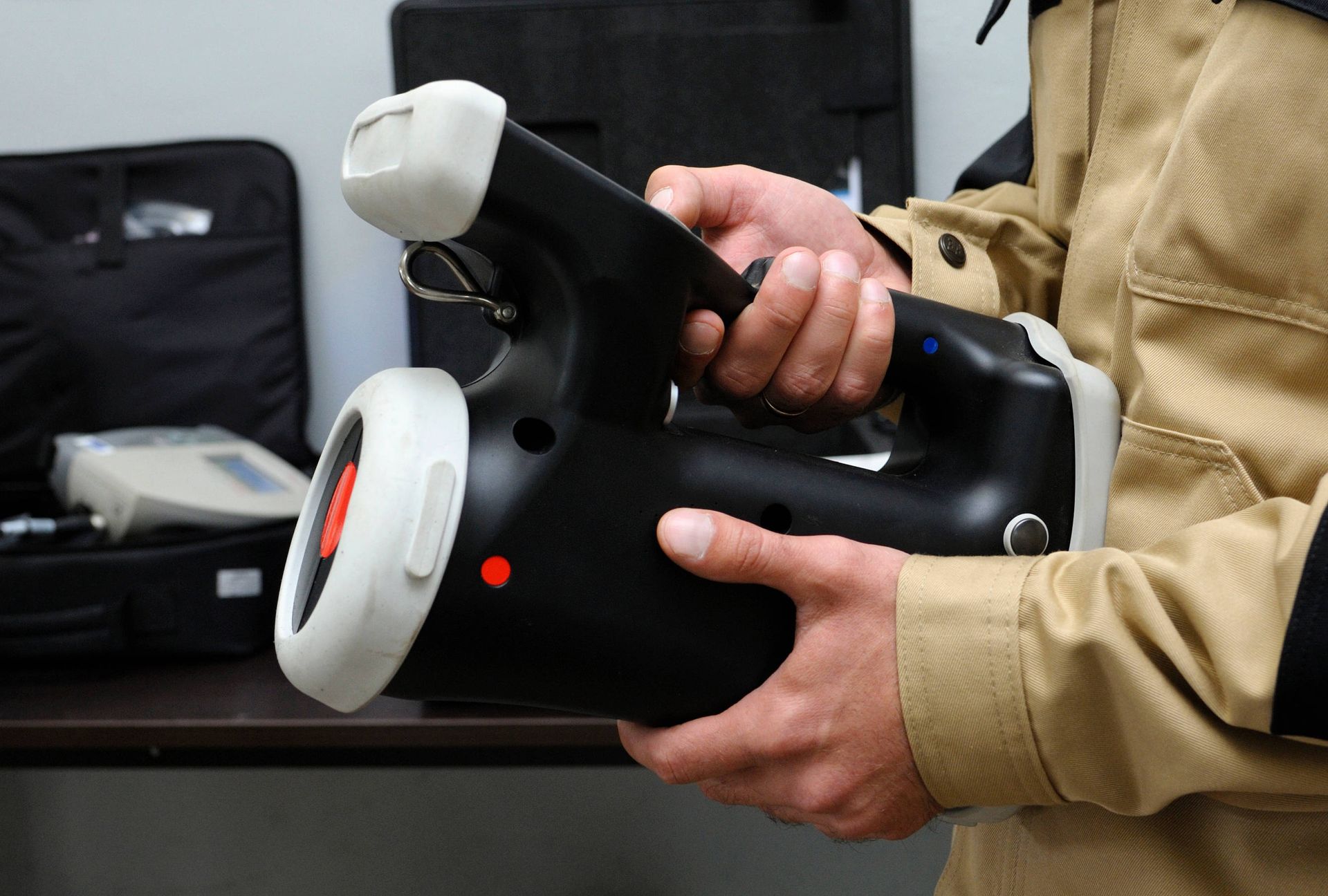 Home inspector holding a radon tester