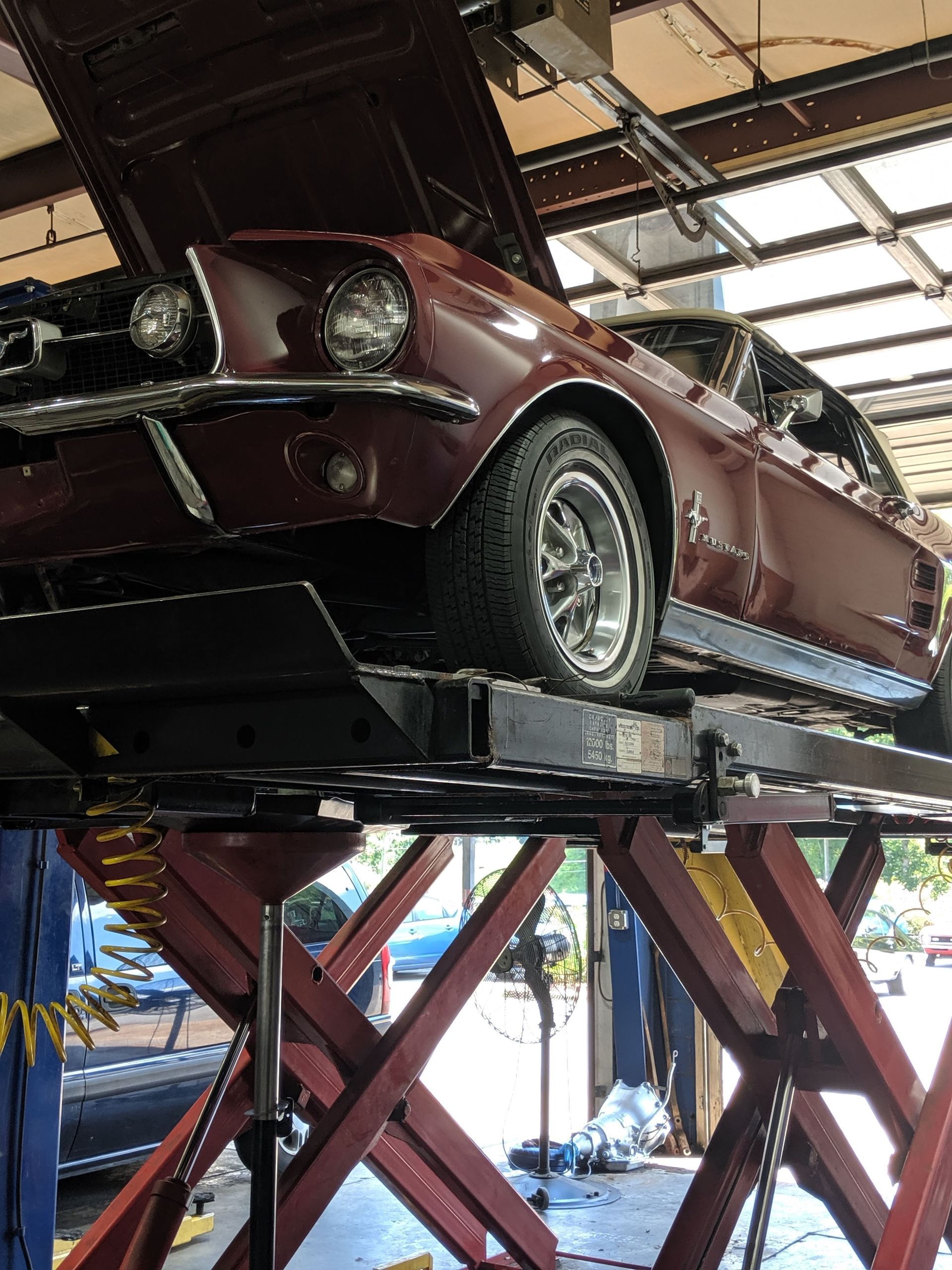 Mustang on a Lift | Bill's Auto Clinic, Inc.