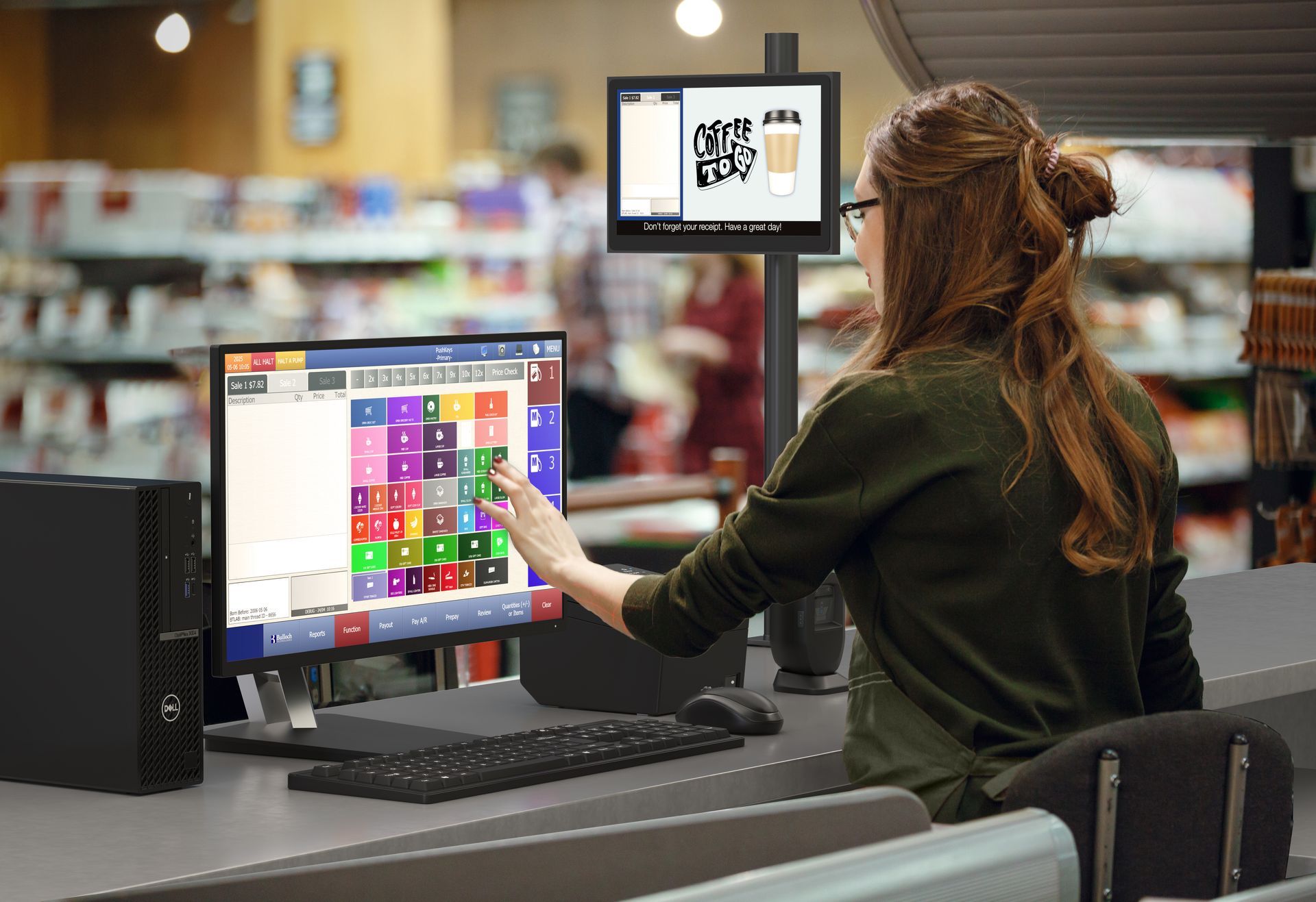 A cashier is operating a point of sale.