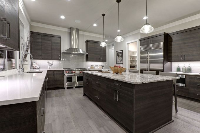 a kitchen with stainless steel appliances and granite counter tops