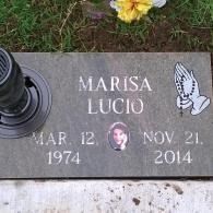 Gravestone for Marisa Lucio with dates, with praying hands and a photo medallion