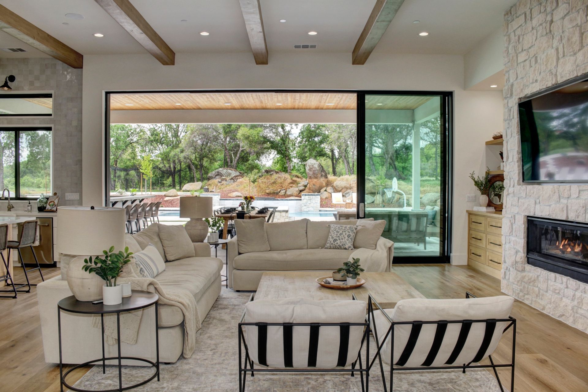 A living room filled with furniture and a fireplace.