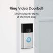A ring video doorbell is sitting on a white door.