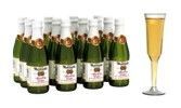 A row of bottles of champagne next to a glass of champagne.