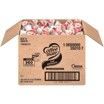 A cardboard box filled with candy on a white background.