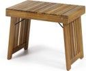 A small wooden table is sitting on a white surface.