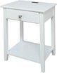 A white table with a drawer and a shelf underneath it.
