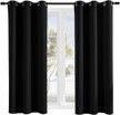 A pair of black curtains are hanging on a window.