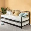 A day bed with a mattress underneath it in a living room.