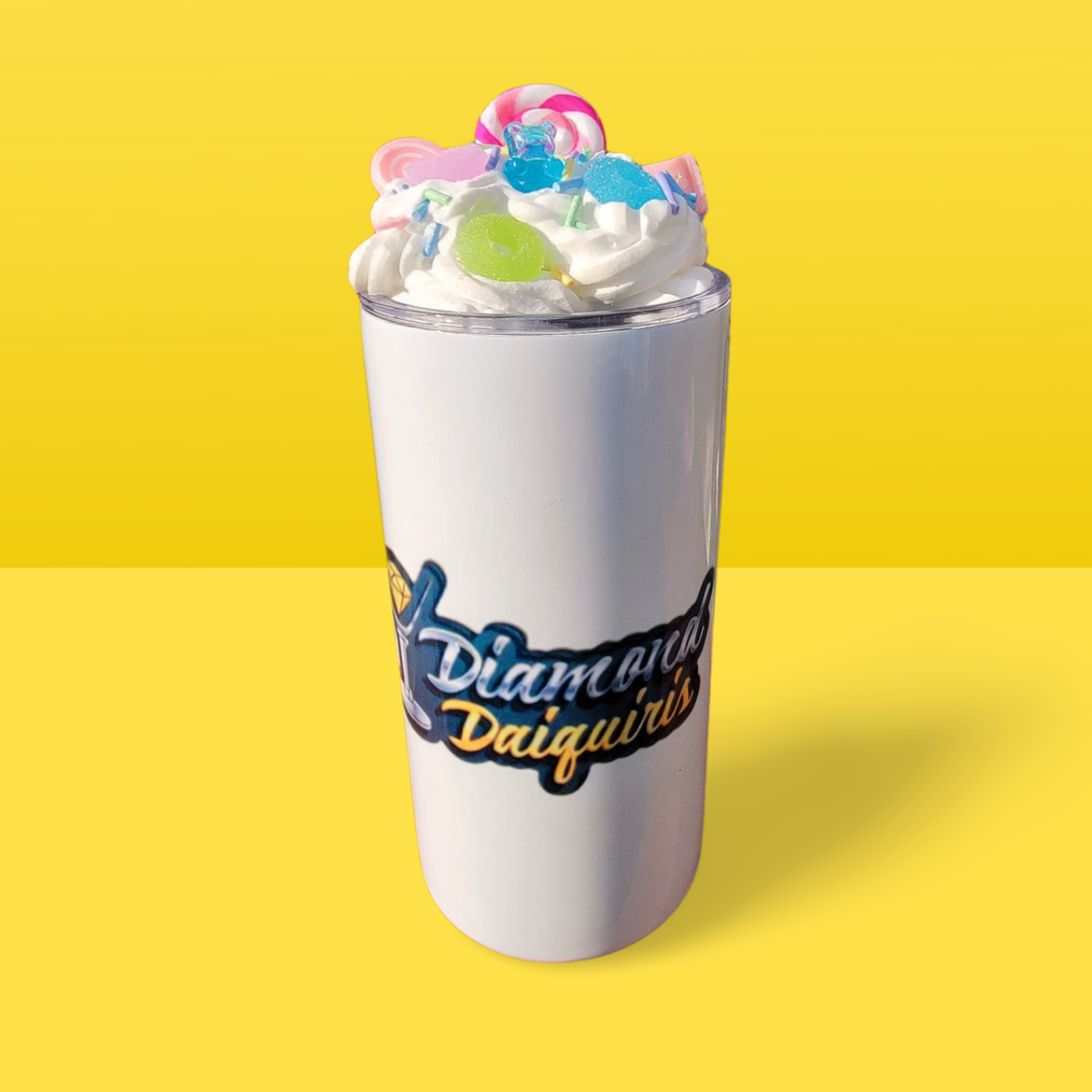 A white tumbler with diamond daiquiris written on it