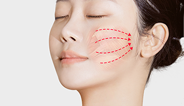 Woman's face with dotted lines showing massage technique, eyes closed, against a white background.