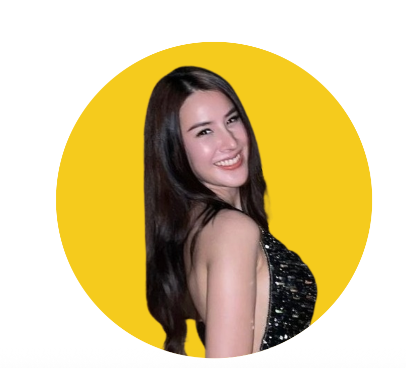 Woman smiling, wearing a black dress with long brown hair, set against a yellow circle.