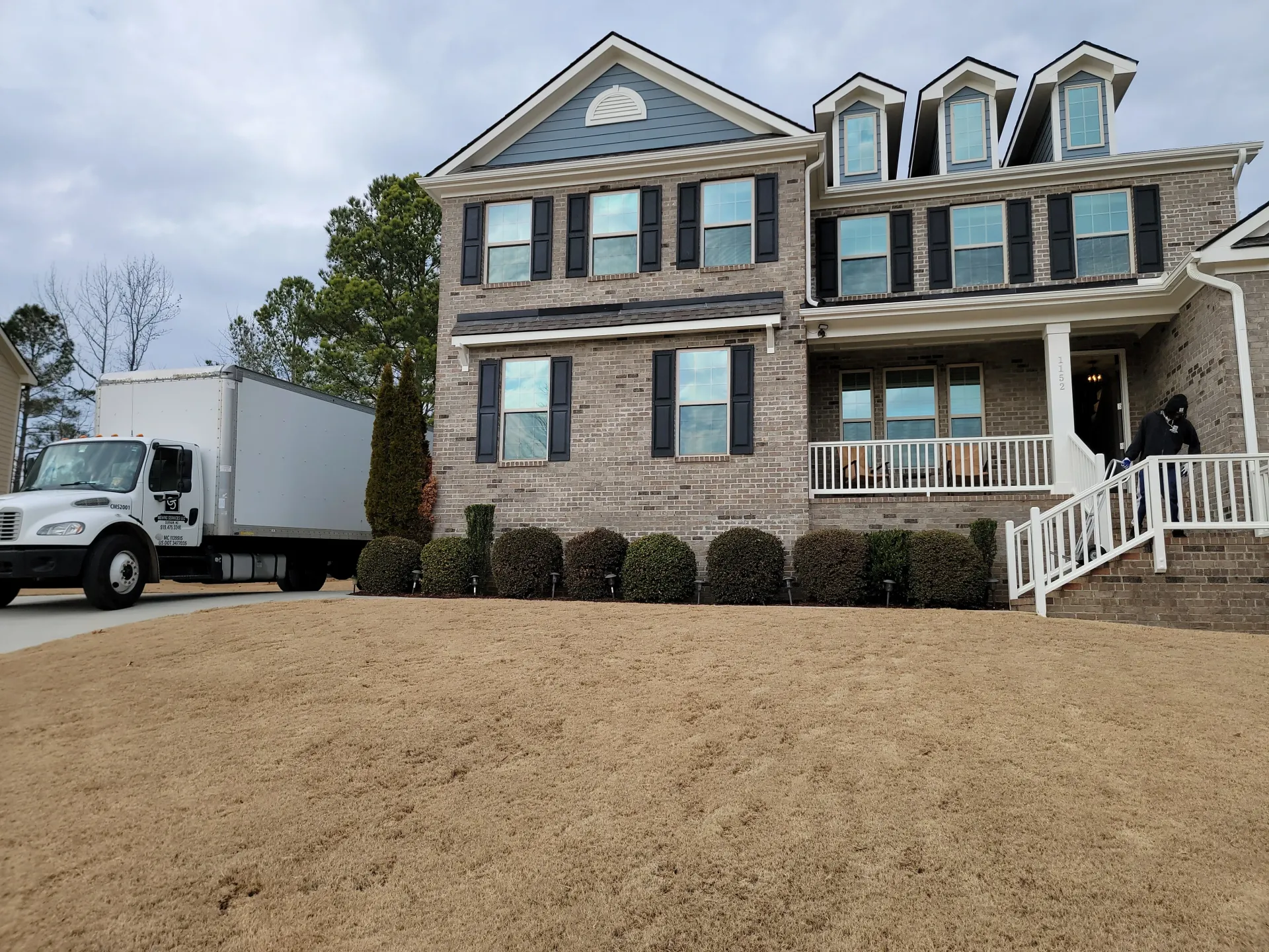 CJ Moving Services moving truck outside a Raleigh NC home