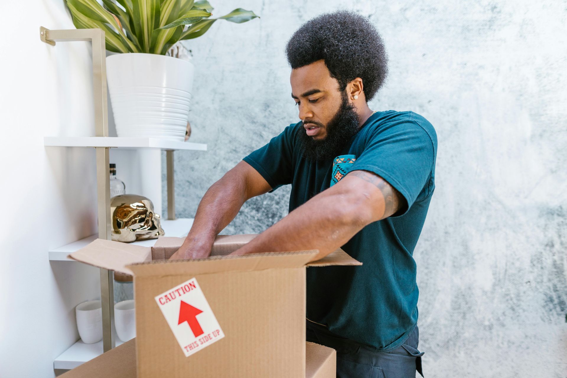 A professional mover packing things before moving