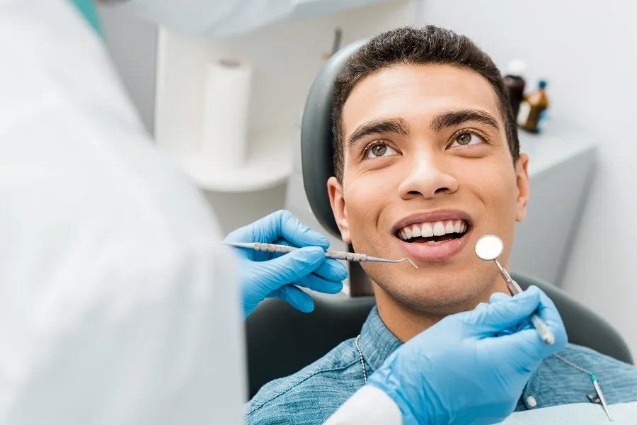 Man During Examination in Dental Clinic — Amherst, OH — Gregory Sy, DDS