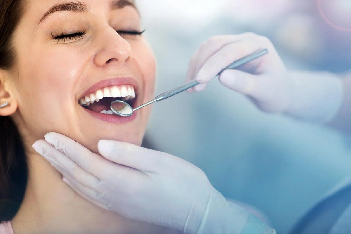 Patient at the Dentist Getting Her Teeth Cleaned — Amherst, OH — Gregory Sy, DDS