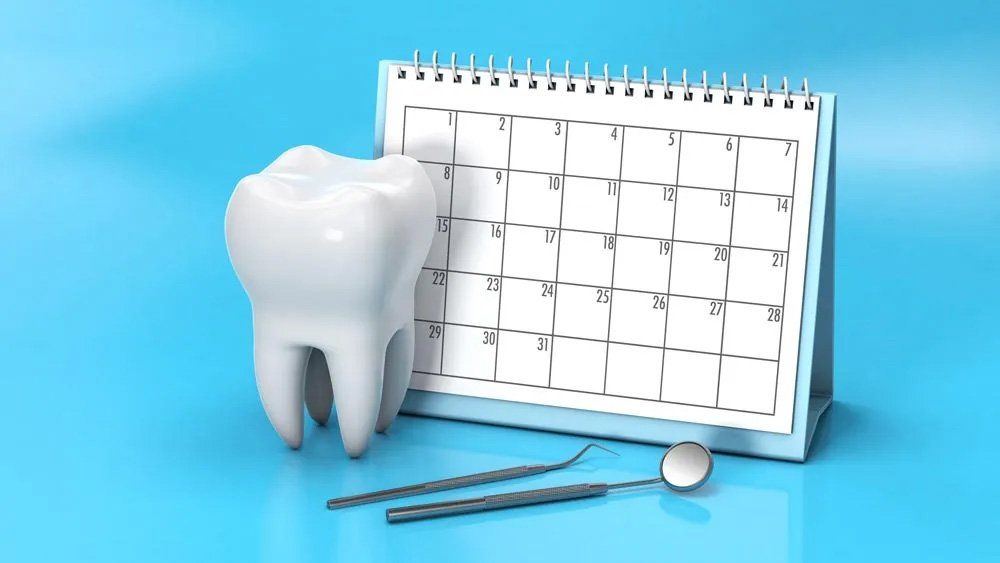Calendar with a Tooth and a Dental Mirror — Amherst, OH — Gregory Sy, DDS