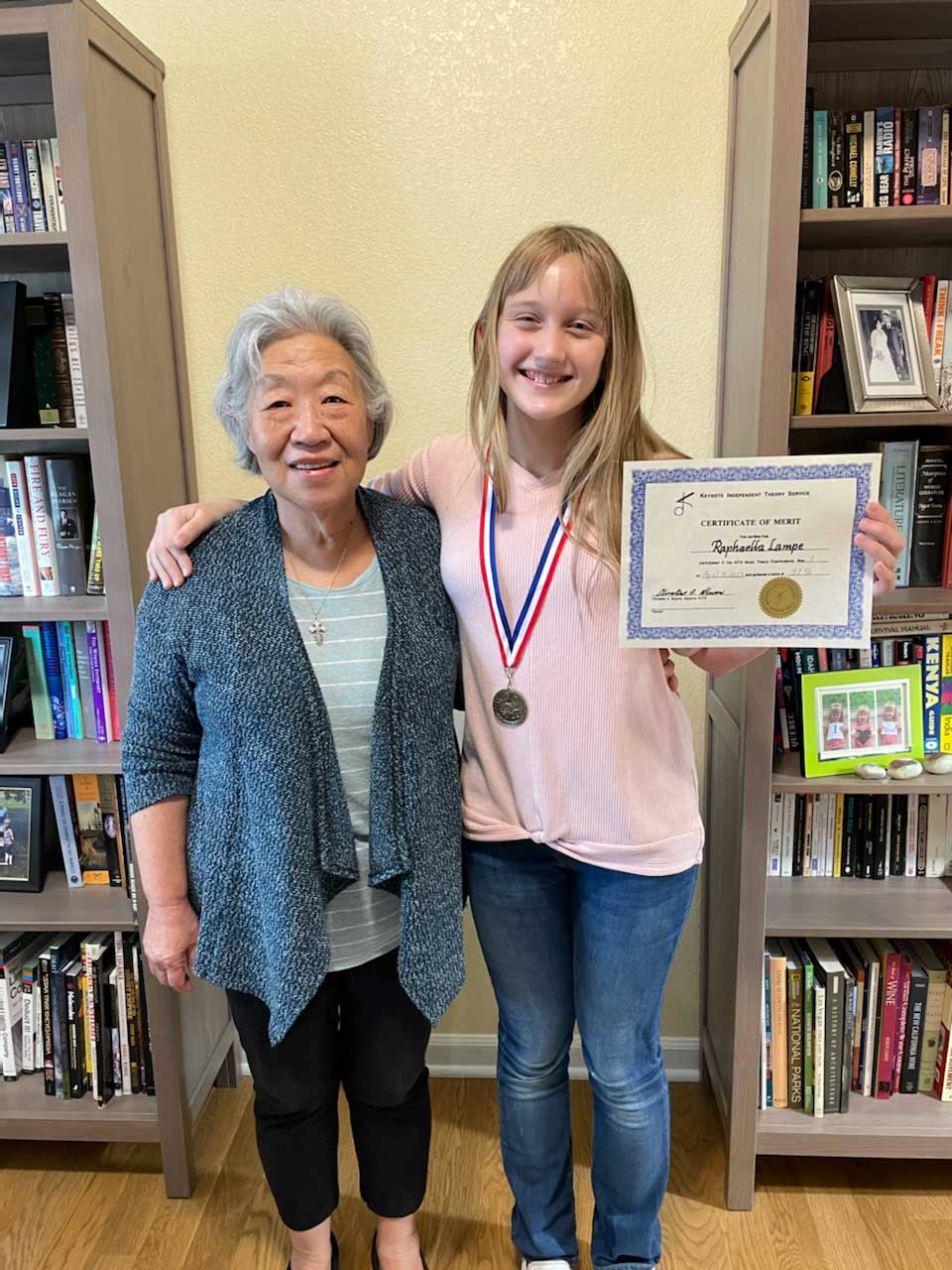 Little kid holding her certificate — Aurora, CO — Calliope Music Studios