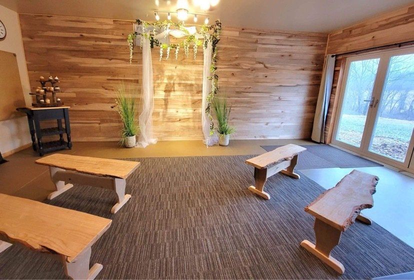 a room with wooden benches and a wooden wall .