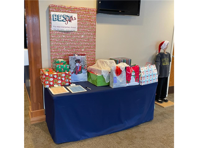 A table with lots of gifts on it in a room for allen elementary school for best gifts.