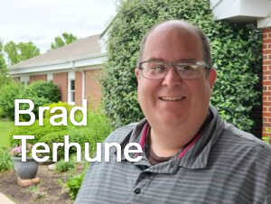 Brad Terhune, Worship Pastor, is standing in front of Hanfield GMC.