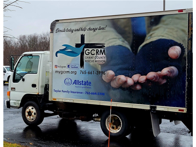 A white truck with a gcrm logo on the side