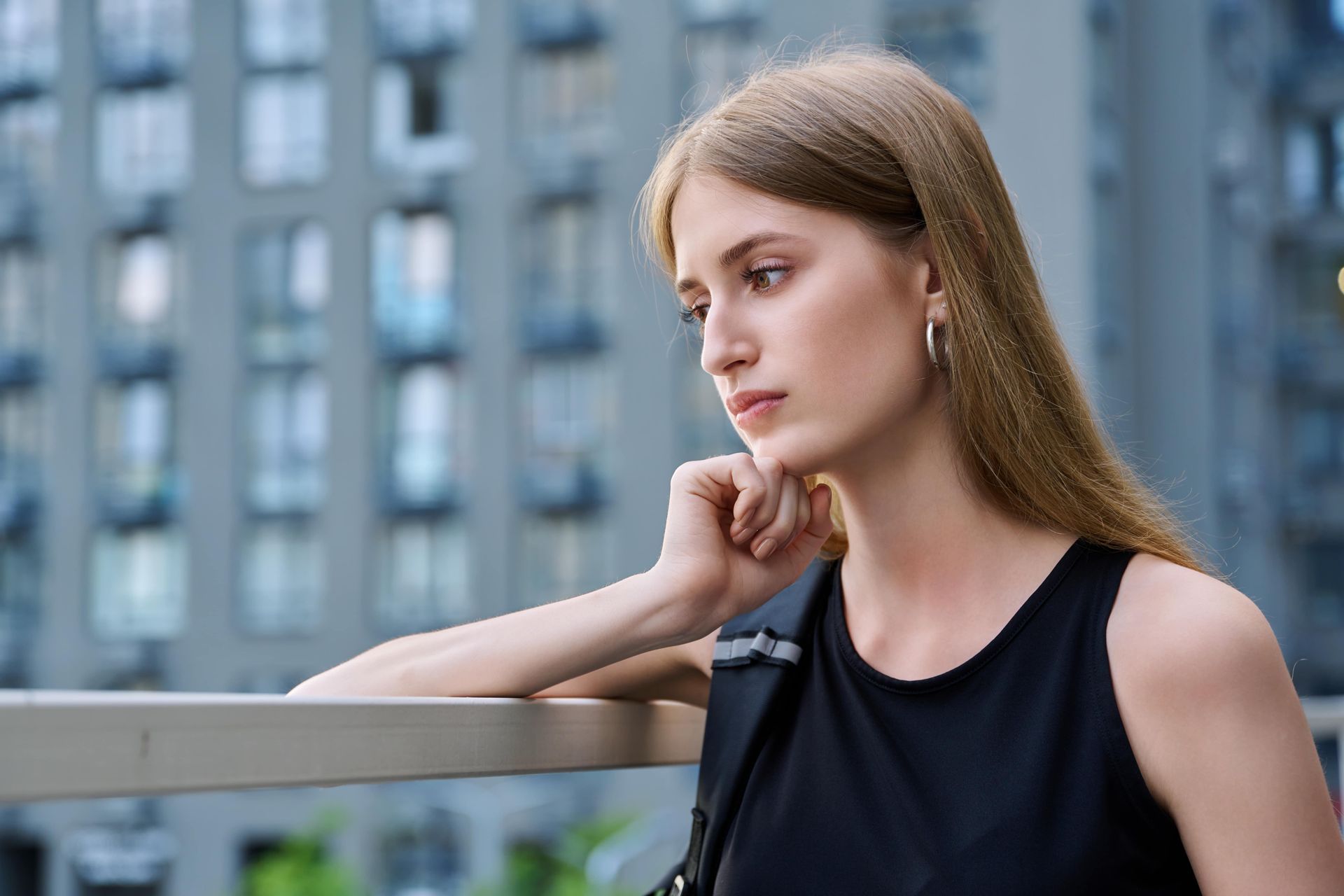 Woman feeling sad and discouraged after experiencing church hurt