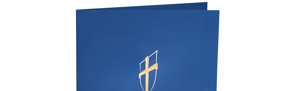 A blue folder with a gold cross on it.