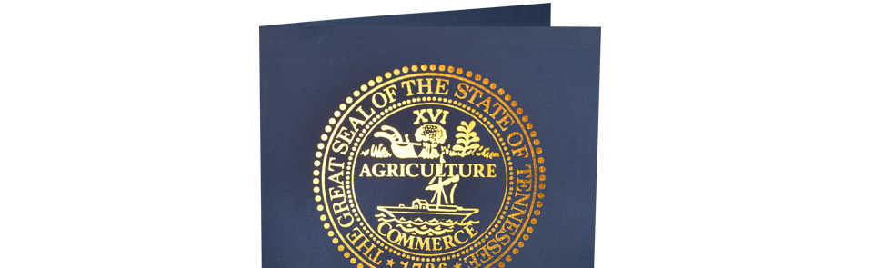 A blue book with a gold seal that says agriculture