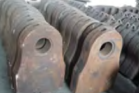 Stacks of Rusty Metal Pieces With Circular Holes — Northern Heavy Machinery in Mount Louisa, QLD