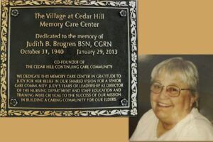 Plaque honoring Judith B. Brogren, with her photo. Dedicated to her memory for her work in elder care.