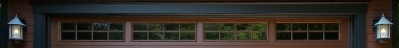 Garage Windows The top windows of a painted garage door.