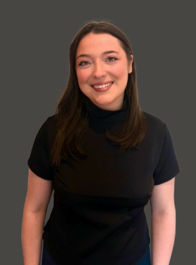Smiling person in a black top against a dark gray background