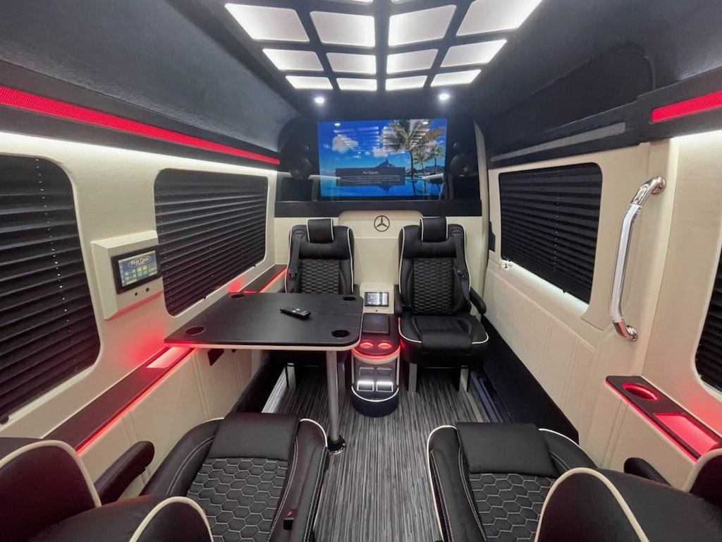 Jet Sprinter interior with first-class captain's chairs for 7 passengers, FBO transfers to Star Island