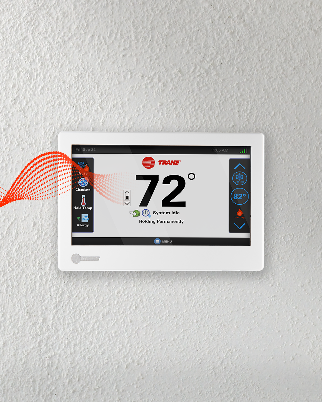 White wall-mounted thermostat display showing 72° with blue and orange side controls White wall-mounted thermostat display showing 72° with blue and orange side controls