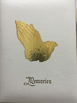 Praying hands in gold over "Memories" script on white.