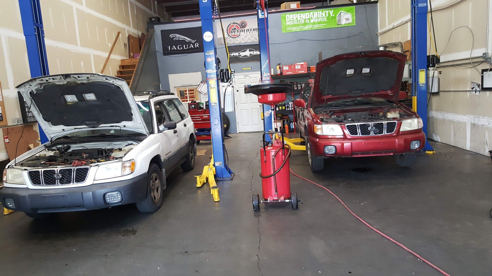Vehicles Inside Auto Repair Shop During Service in Kennesaw, GA | Revolution Auto Service
