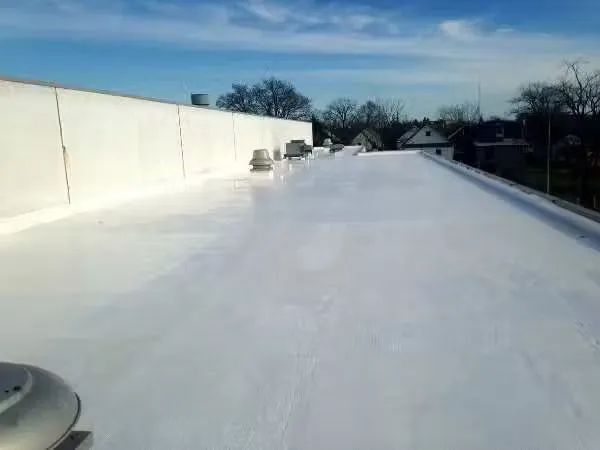 A white roof with a blue sky in the background.