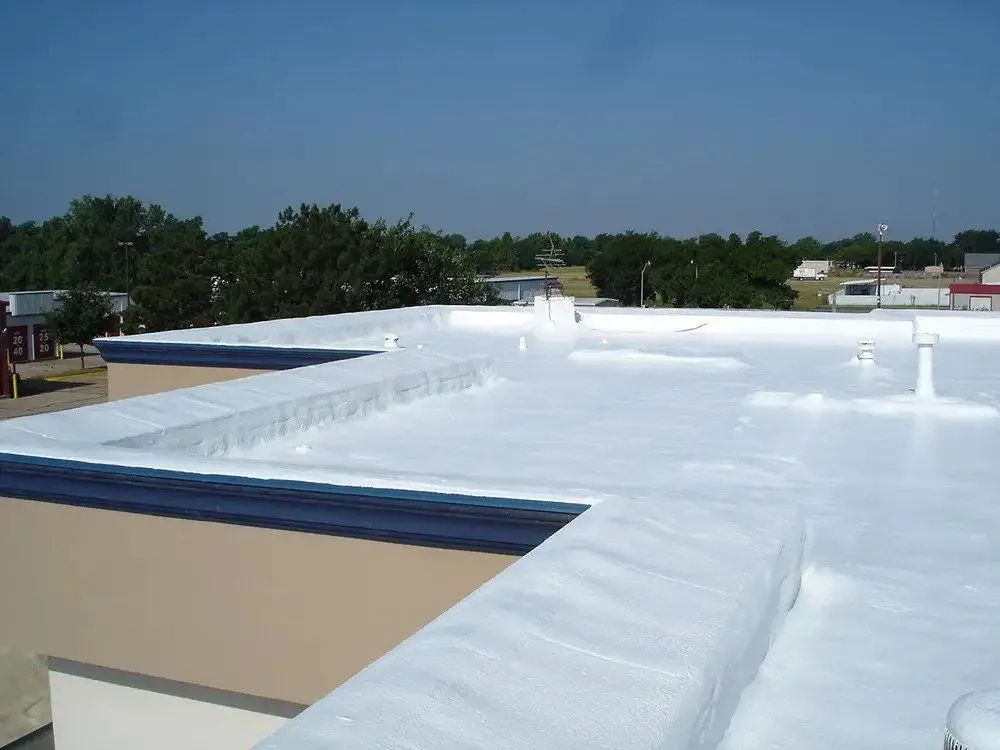 The roof of a building has been painted white