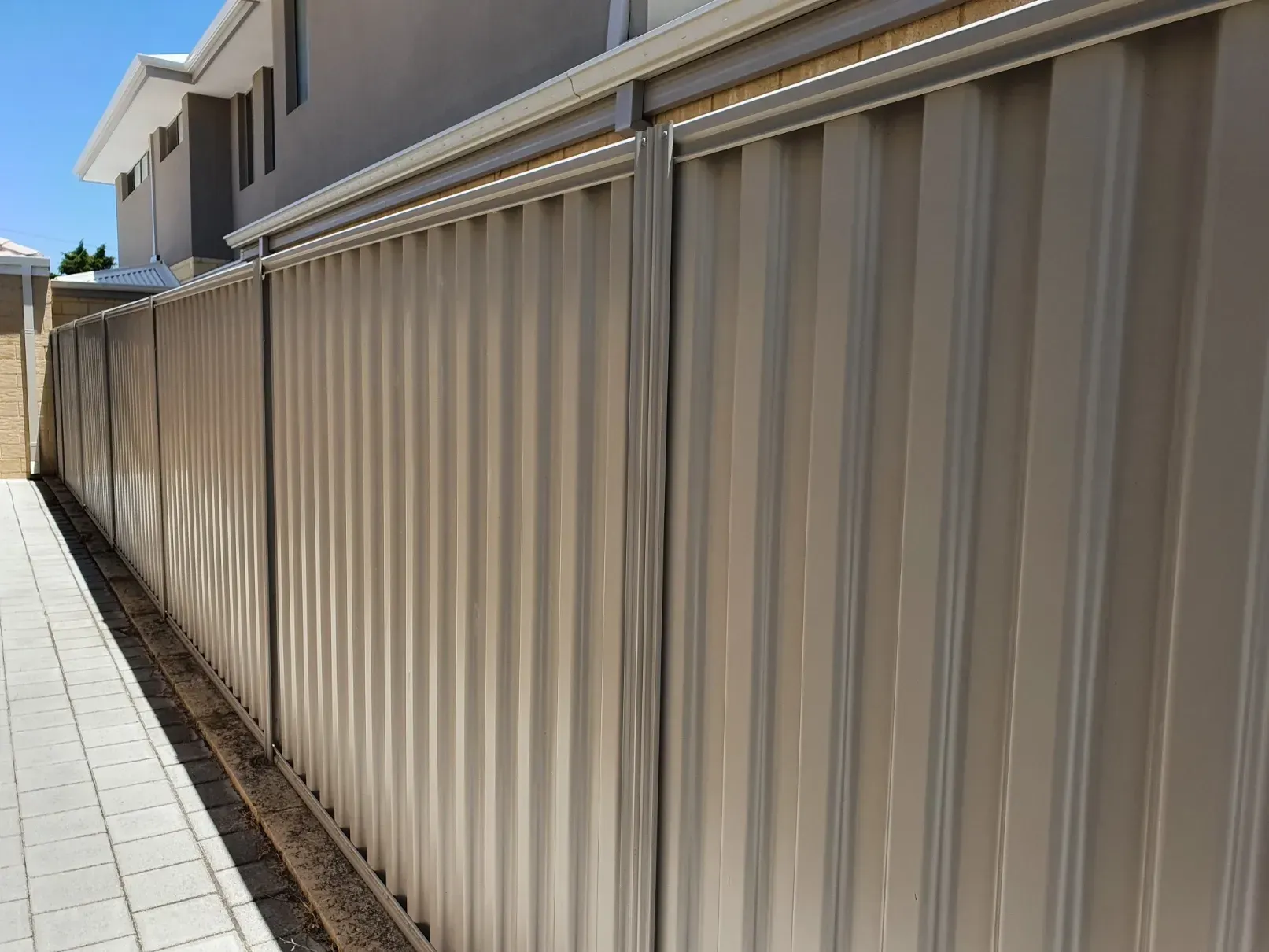 Cream Colorbond fencing installed in a residential property for security and aesthetics in Ballarat VIC.