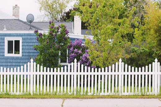 Freshly polished timber fence installed as boundary fencing for a housing estate in Ballarat, Victoria.