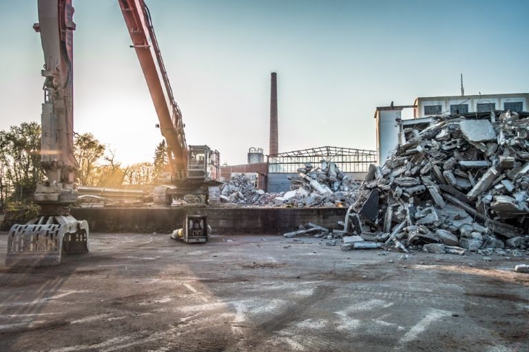 A Large Pile of Scrap Metal is Being Processed in a Factory — Al's Excavation in Sunshine Coast, QLD