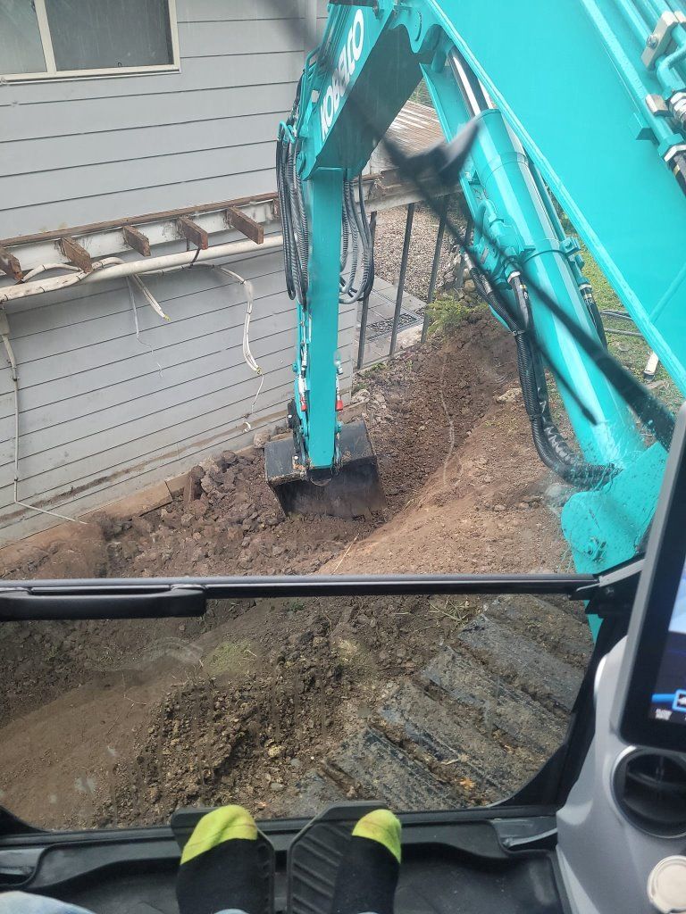 A Person is Sitting in the Driver 's Seat of an Excavator — Al's Excavation in Bridges, QLD
