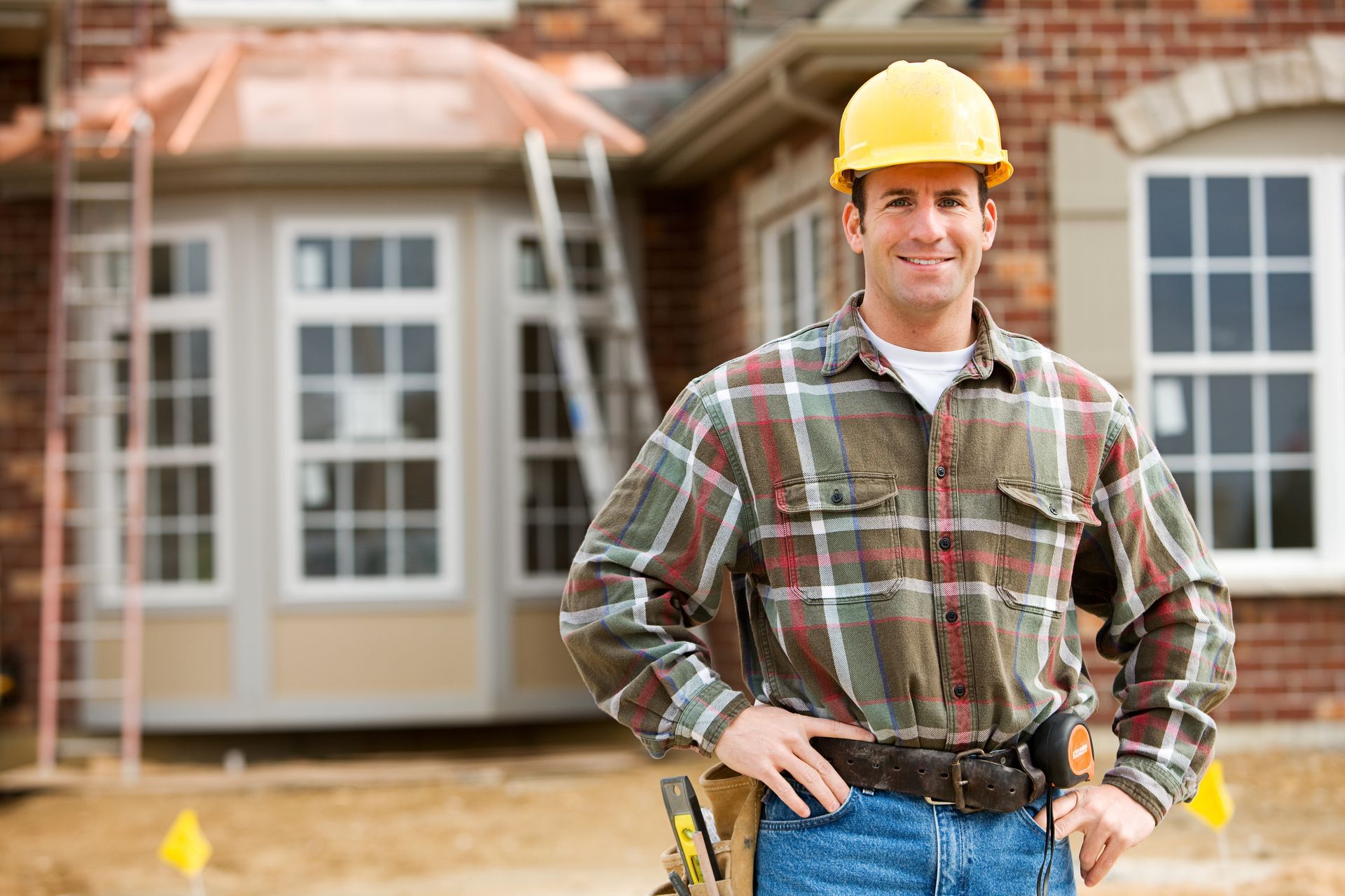 Construction Worker In Front Of House Construction Worker In Front Of House