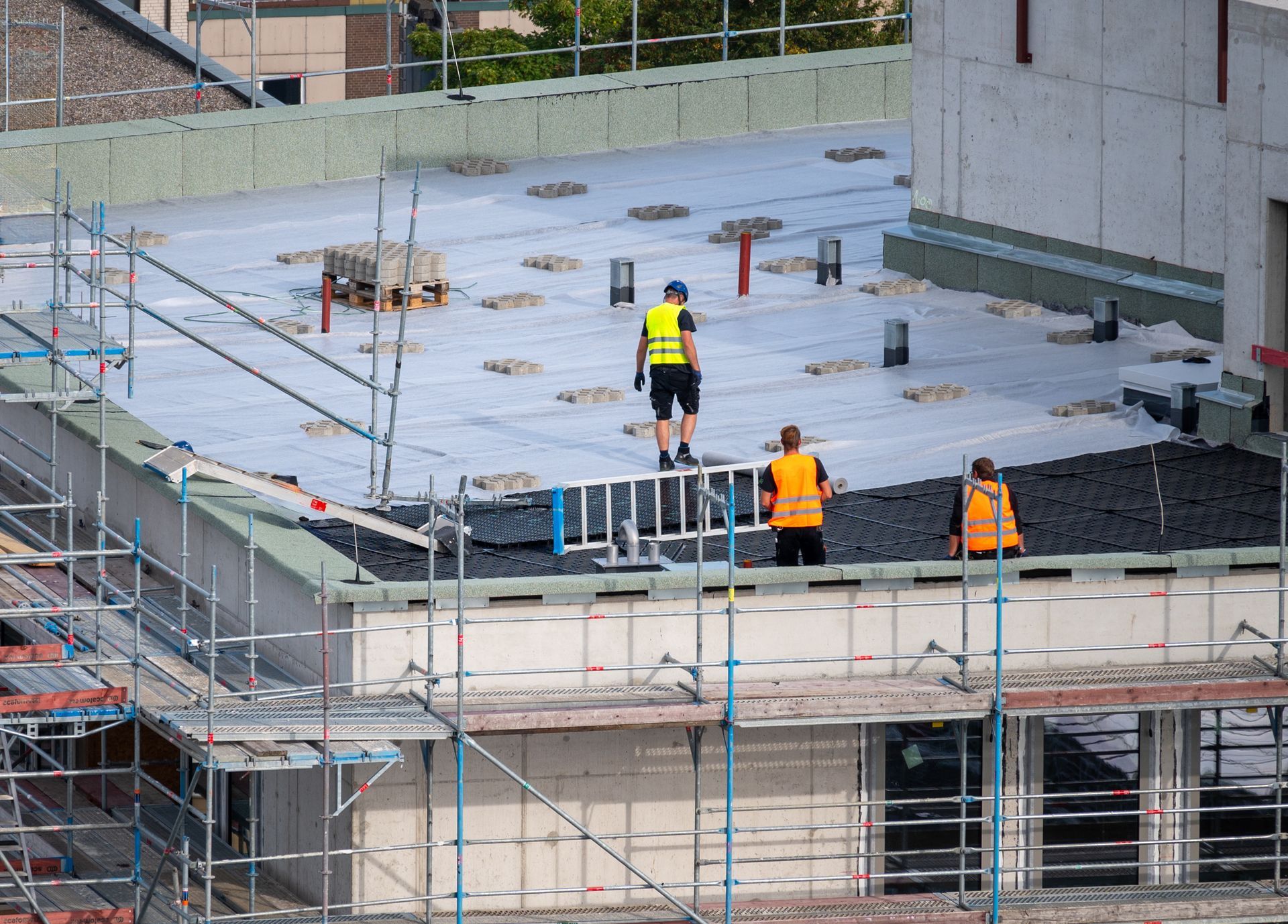 Construction Workers On Rooftop Working Construction Workers On Rooftop Working