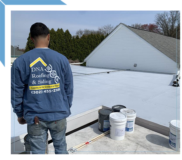 Two Workers Installing Roof Under Cloudy Sky